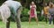 Animation of happy diverse female and male senior friends playing american football in garden