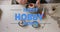 Animation of happy hobby month text over caucasian man painting pottery