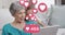 Animation of heart icons and number over caucasian grandmother and grandson using tablet