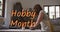 Animation of hobby month text over caucasian woman forming pottery
