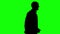 Animation of a large crowd crossing 4K video. Silhouette version. Animation of camera zooming in. green background for