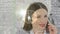 Animation of mathematical operations over businesswoman wearing phone headset