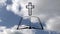 Animation of outline of Christian cross and open holy Bible book over blue clouds