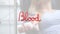 Animation of please give blood text over caucasian female patient