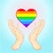 Animation Rainbow colored heart the heart in the armor is forced to defend itself.Human hands hold the Cartoon Rainbow Heart. Gay