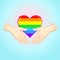 Animation Rainbow colored heart the heart in the armor is forced to defend itself.Human hands hold the Cartoon Rainbow Heart. Gay