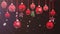 Animation Red Christmas balls with white snowflake on black background.