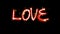 Animation red  light sparkling particles Text LOVE on black background.
