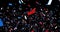 Animation of red, white and blue falling confetti on the dark background. Colors of the America flag. United States of