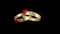 Animation of rotating gold wedding rings.