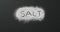 Animation of salt text written in salt on black background