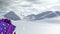 Animation of santa claus carrying huge christmas gift and snow falling in winter landscape