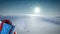 Animation of santa claus carrying huge christmas gift and snow falling in winter landscape