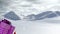 Animation of santa claus carrying huge christmas gift and snow falling in winter landscape