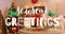 Animation of season greetings text over christmas decorations