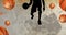 Animation of silhouette of basketball player with basketballs on basketball court background