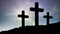 Animation of silhouette of three Christian crosses over moon and sun