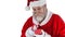 Animation of snow falling over caucasian santa claus holding gift