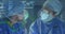 Animation of statistical data processing over two female surgeons performing operation at hospital