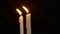 Animation of two candle burning move. Merry Christmas