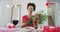 Animation of video interface over african american woman having video call and holding flowers