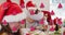 Animation of watermelon icon over caucasian family wearing santa claus hats