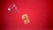 Animation of white particles falling over champagne cork on red background