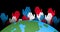 Animation of white, red and blue hands over globe on black background