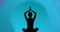 Animation of woman meditating silhouette on blue background