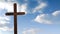 Animation of wooden Christian cross over blue clouds moving in background