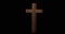 Animation of wooden cross appearing on black background