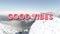 Animation of the words good vibes written in pink letters over hikers on snow covered mountain