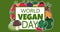 Animation of world vegan day text over fruit and vegetable on green background