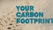 Animation of your carbon footprint text over shapes on beige background