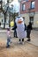 Animator in a penguin costume on a city street. Advertising on the street. Work in advertising