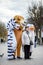 Animators in the costume of a lion, a penguin and a zebra from the cartoon Madagascar in the city. Advertising on the street