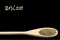 Anise on wooden spoon isolated on black background. Latin name Pimpinella