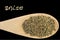 Anise on wooden spoon isolated on black background. Latin name Pimpinella