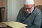 Ankara/Turkey - 24.04.2020: Very old Turkish muslim man reciting Qur`an in Ramadan