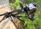 Ankara/Turkey-July 15 2019: Taking a flower photograph with a camera, and tripod on a sunny day. Red flower of Tagetes  growing in