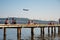 Ankaran, Slovenia - June 26, 2020: Airplane flying dangerously close to a beach full of people