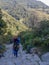 Annapurna Base Camp hiking trek, Himalayas, Nepal. November, 2018. A hiker walking up on the stone path with a huge tourist