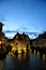 Annecy, France - JUNE 19, 2015 People relaxing, walking, and eating around Palace of the Isle and river Thiou