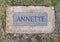 Annette nameplate for marble cow by Harold Fooshee Clayton standing in Trinity Lake Park in Dallas, Texas.