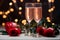 Anniversary and Valentines concept Red roses and sparkling rose wine glasses