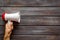 Announcement with megaphone in hand on wooden background top view mockup