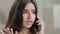 Annoyed arabian angry teenage girl furious emotional woman talk smartphone has quarrel by mobile phone answers call
