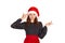 Annoyed and displeased woman in dress shrugging and holding fingers on temple. emotional girl in santa claus christmas hat isolate