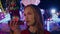 Annoyed girl talking loudspeaker in amusement park closeup. Unhappy pretty teen