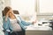 Annoyed pregnant woman having stress at work